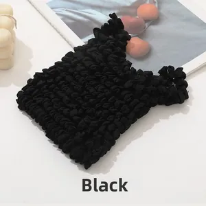 Detailed macro view of black stretch bubble textured tote bag with pleated fabric detail