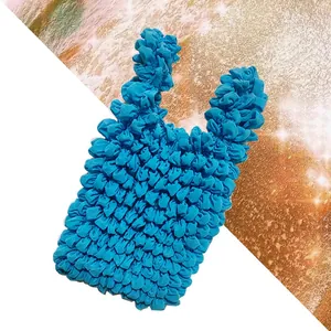 Detail of royal blue bubble bag featuring unique 3D stretch texture and elastic fabric