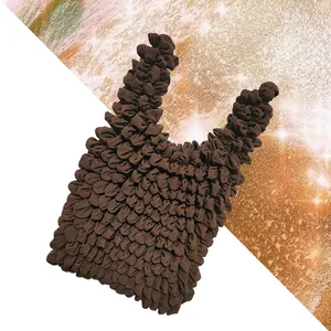 Macro detail of dark brown stretch bubble bag with unique textured pleated fabric design