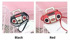Close-up of retro radio shaped handbags in black and red with metallic top handles