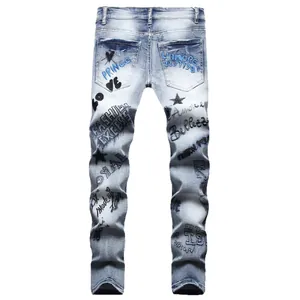 Men's slim fit light blue denim jeans with street style graffiti and heavy embroidery back view