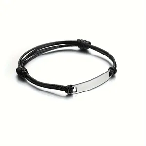 Adjustable woven black rope bracelet with polished stainless steel bar for engraving