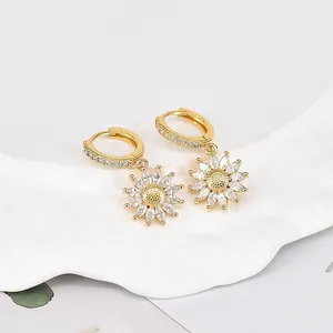 Macro detail of sunflower pendant earrings with marquise cubic zirconia petals