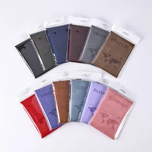 Various colored PU leather passport covers featuring world map patterns in clear packaging