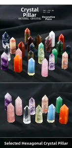 Variety of natural crystal obelisk towers on black fabric, including amethyst and rose quartz