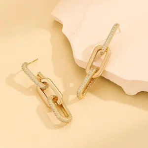 European gold chain earrings with interlocking links and shimmering cubic zirconia stones