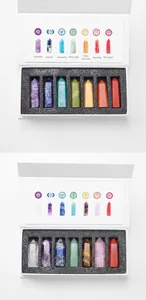 Detailed view of seven chakra natural crystal pillars in a white gift box with labels