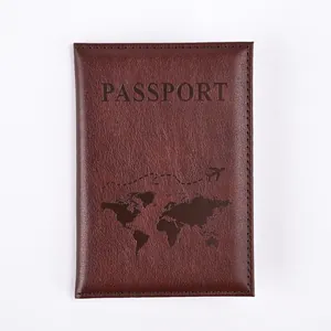Macro view of dark brown PU leather passport cover with embossed map and flight path