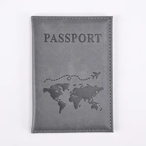 Close-up of grey PU leather passport cover with world map print and stitched edges