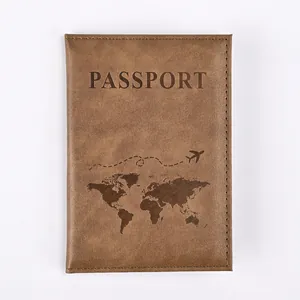 Detail of brown PU leather passport holder with embossed world map and stitching