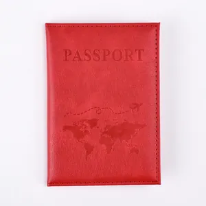 Detail of red PU leather passport cover with embossed world map and aircraft pattern