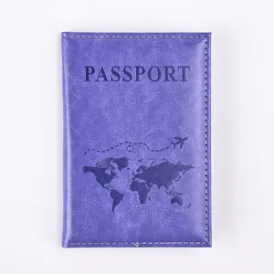 Macro detail of dark purple PU leather passport cover with world map and white stitching