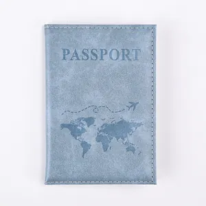 Detail of light blue PU leather passport cover with world map and airplane design