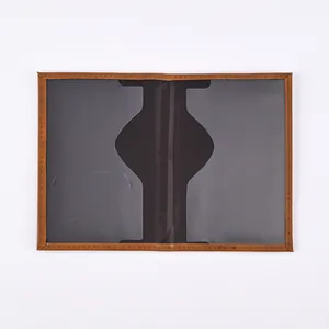 Detail view of brown PU leather passport holder showing grey translucent pockets and stitching