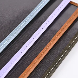 Close-up of premium PU leather edges with fine stitching in blue purple brown and green