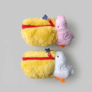 Detail of plush pelican storage bag featuring soft texture and colorful zippers