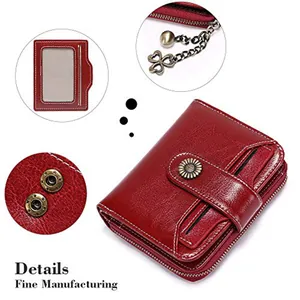 Detail view of deep red leather wallet with sunflower clasp and heart chain pendant