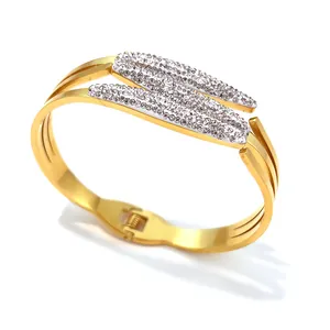 Elegant gold stainless steel ripple bangle with shimmering rhinestone leaf details