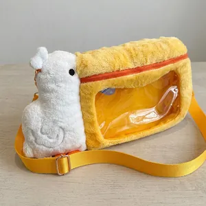Detail of yellow plush pelican bag with transparent window and adjustable strap