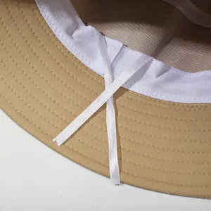 Khaki cotton bucket hat showing breathable mesh lining and adjustable inner drawstrings