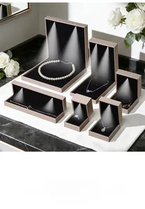 Detail of premium champagne LED jewelry boxes for necklaces and rings with focused spotlight
