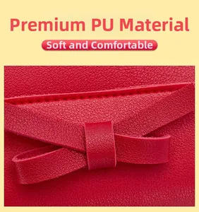 Detail of red PU leather mini bag showing bow decoration and lychee grain texture