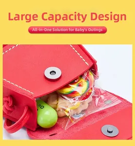 Detail of red mini crossbody bag for girls showing storage capacity with cute snacks