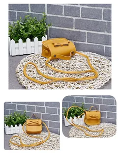 Three-view display of a yellow mini PU leather girl bag with a bow and long strap