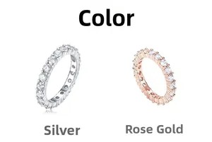 Detail of eternity rings in silver and rose gold finishes with circular pavé stones