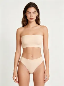 Close-up of seamless beige tube top and high-waist brief set with elastic fabric