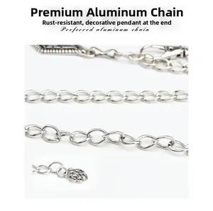 Detail of vintage silver metal waist chain featuring floral pendant and aluminum links