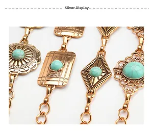 Detail of bohemian gold metal belt with vintage flower patterns and turquoise stones