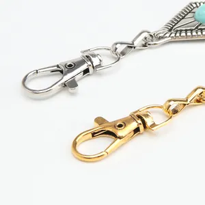 Vintage metal waist chain lobster clasp with turquoise stone detail on white background