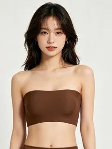 Detail of high-elastic seamless tube top in dark brown showing smooth fabric and fit