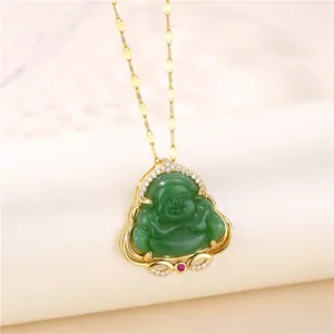 Detail of gold-plated Maitreya Buddha pendant with green chalcedony and red gemstone