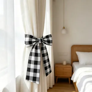 Detail of a black and white gingham bow tie used as a decorative curtain tieback