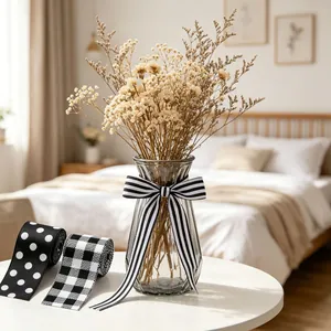 Close-up of decorative black and white ribbons with stripes and dots for gift wrapping