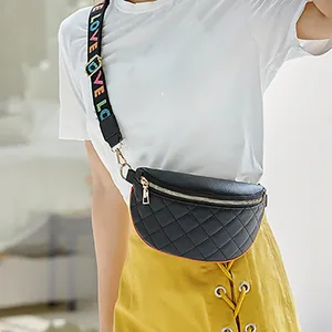 Quilted black waist bag with colorful LOVE wide strap worn as a crossbody chest pack