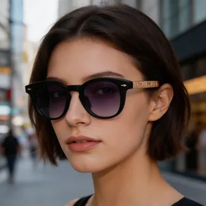 Close-up of square sunglasses with golden engraved temples and star rivet details