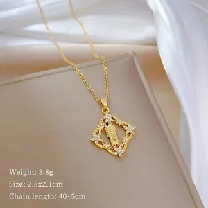 Detail of gold pendant necklace showing square relief and dimensions 2.8x2.1cm