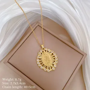 Detailed view of Virgin Mary oval pendant with golden plating and zirconia settings