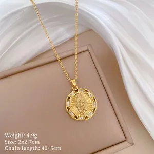 Detail of gold Virgin Mary pendant with white crystals and size specifications