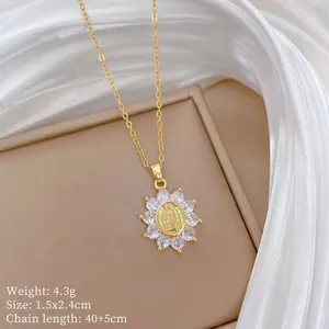 Macro detail of gold Virgin Mary pendant with sunflower frame and zircon inlay settings