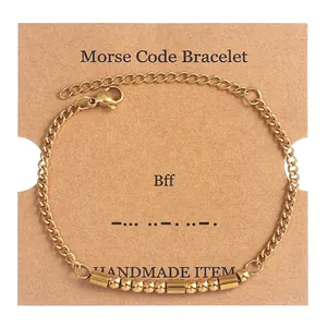 Detail of gold Morse code bracelet for BFF on kraft paper card with adjustable clasp