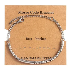Detail of silver Morse code beaded bracelet on handmade card with Best Bitches engraving