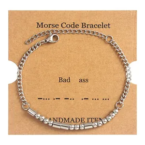 Detail of silver Morse code bracelet with beads on a Bad Ass handmade display card