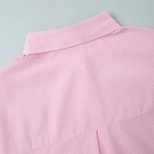 Detail of pink and white striped shirt collar with neat stitching and cotton texture