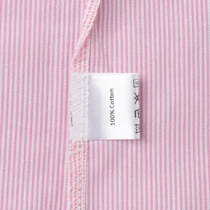 Close-up of a pink striped shirt showing 100% cotton fabric and quality stitching