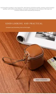 Close-up of vintage brown leather mini cosmetic bag with gold zipper on wooden surface