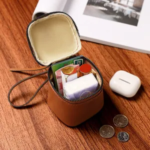 Vintage brown leather mini round makeup bag and coin purse with zipper and wrist strap